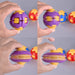 A split-screen demonstration of a purple and yellow plastic ball puzzle toy being manipulated by hands. The toy is shown both assembled and disassembled into separate pieces, with other colorful balls blurred in the background against a solid gray surface. Fidgit Sphere Spinner