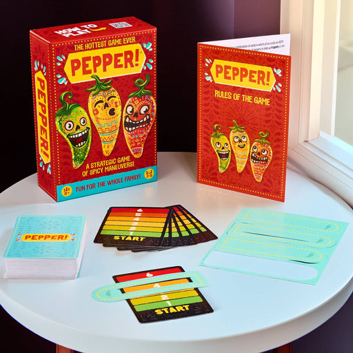 Board game 'PEPPER!' with colorful cards and rules on a round table.