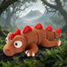 Toy dinosaur with red spikes in a forest setting from Heebie Jeebies