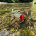 Blue M frog from Heebie Jeebies with a red shirt in clear water