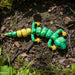 Heebie Jeebies 3D Toy lizard on a natural ground surface with grass and leaves