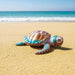 Heebie Jeebies 3DSea turtle on a sandy beach with ocean in the background toy 