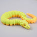 Heebie Jeebies 3D toy snake with green body and orange head and tail on a light gray background