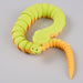 Heebie Jeebies 3D toy snake with green body and orange head and tail on a light gray background