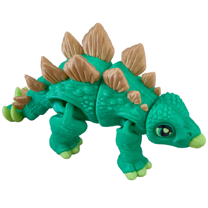 Heebie Jeebies 3D stegosaurus dinosaur figure with green body and brown spikes on a white background