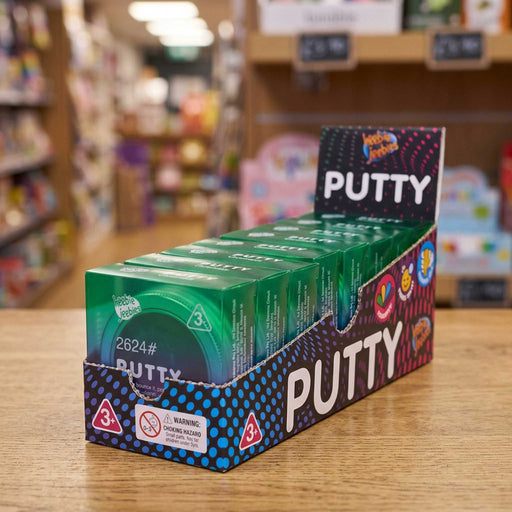 A retail display box filled with small green and blue packages of Hula Hula Putty, placed on a wooden table in a blurred store setting.
