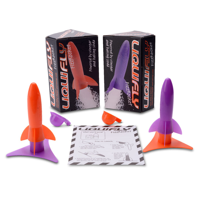 Two colorful rocket-shaped toys with packaging and accessories on a white background