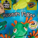 Toy packaging with a green creature, blue background, and visible branding.